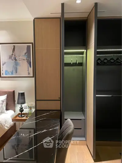 Modern bedroom with stylish walk-in closet and elegant decor