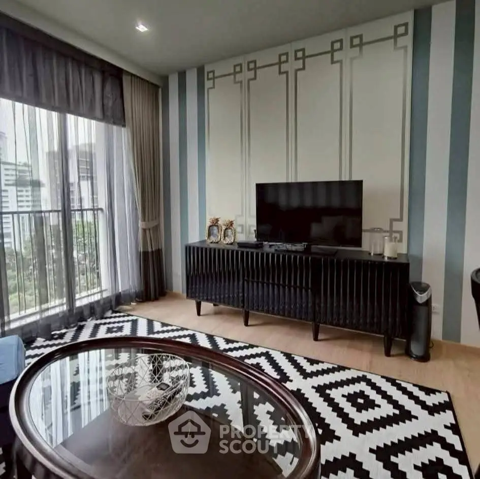 Stylish living room with modern decor and city view from balcony