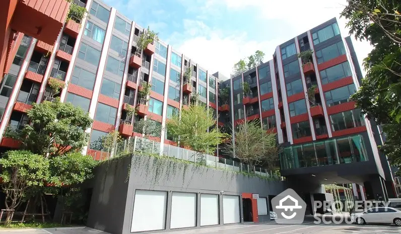 Modern residential building with lush greenery and spacious balconies