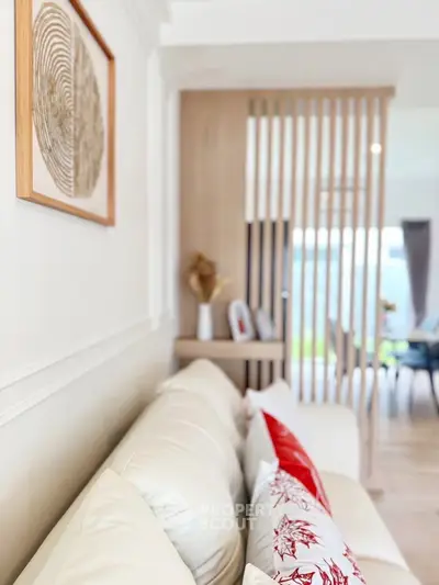 Modern living room with stylish decor and cozy white sofa