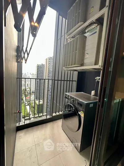 Modern balcony with washing machine and city view, ideal for urban living.