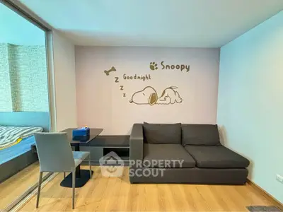 Cozy living room with Snoopy wall art and modern furniture