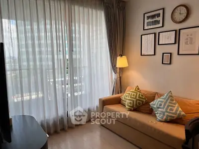 Cozy living room with modern decor and large window view