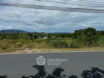 Scenic land plot with mountain views and lush greenery, ideal for development or investment.