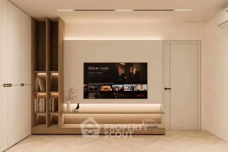 Modern living room with built-in wooden shelves and wall-mounted TV, showcasing minimalist design.