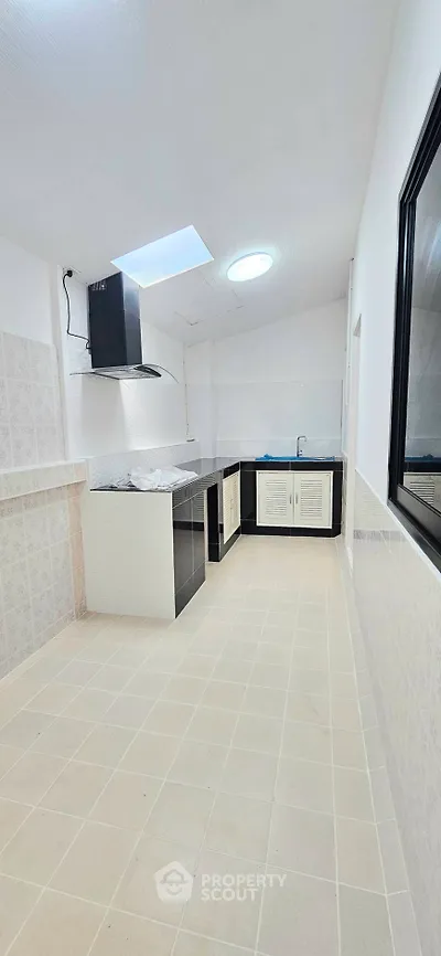 Spacious kitchen with modern design and ample natural light