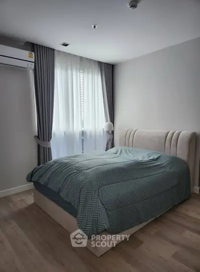 Cozy bedroom with modern decor and natural light