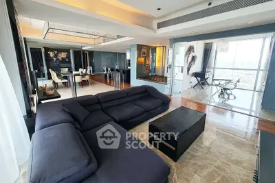 Luxurious modern living room with panoramic city views and elegant furnishings.