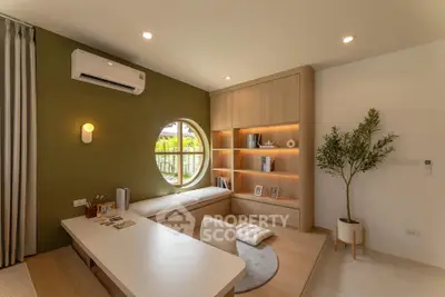 Modern study room with built-in shelves and circular window