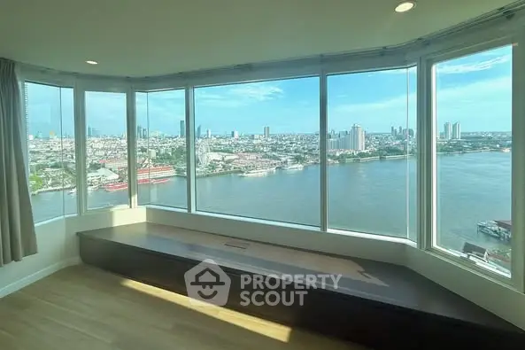 Stunning panoramic river view from high-rise apartment with large windows