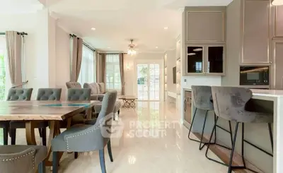 Spacious open-plan living and dining area with elegant furnishings and natural light.