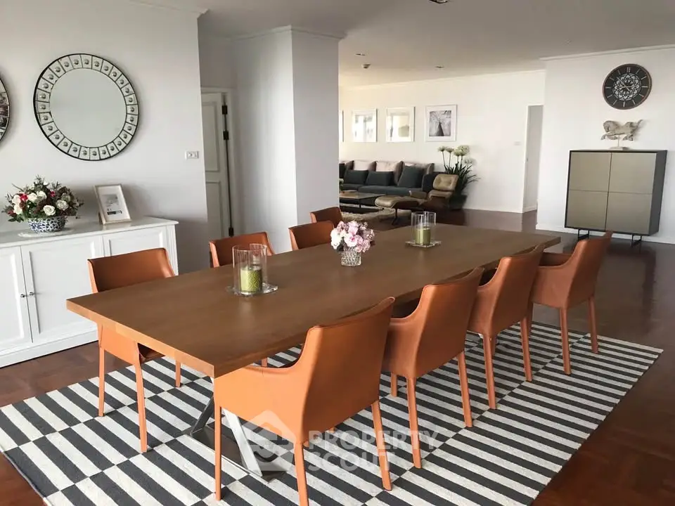 Spacious dining area with elegant decor and modern furniture in a stylish home.
