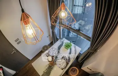 Modern dining area with stylish lighting and city view
