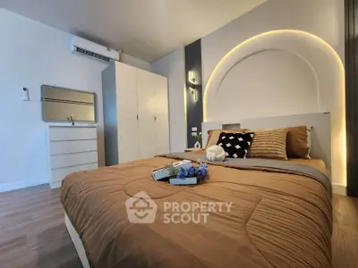 Modern bedroom with stylish decor and ambient lighting