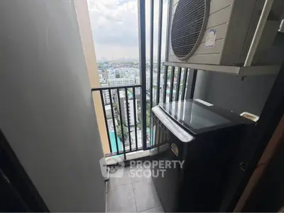 Compact balcony with city view and air conditioning unit