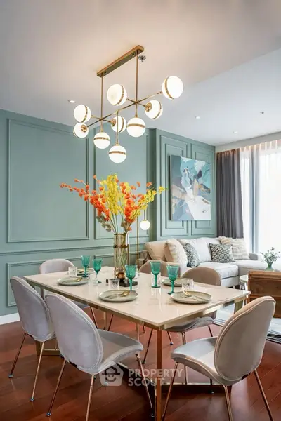 Elegant dining area with modern chandelier and stylish decor in a luxurious living room setting.