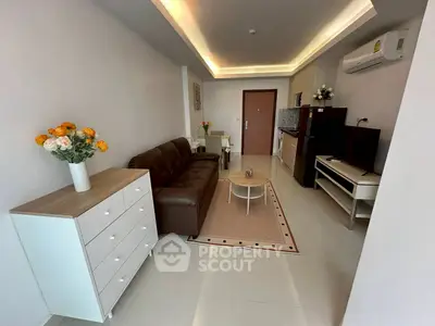 Modern living room with sleek furniture and open kitchen layout