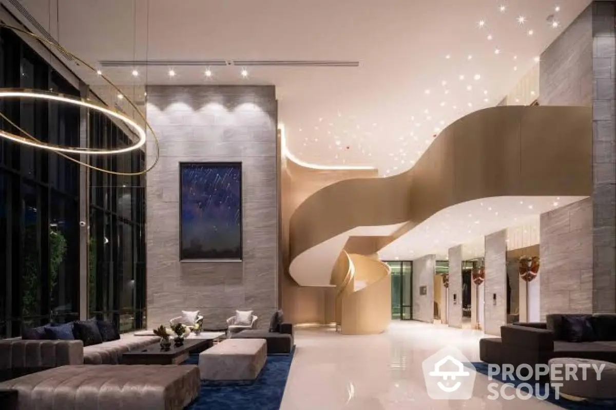 Luxurious modern lobby with elegant spiral staircase and stylish seating area