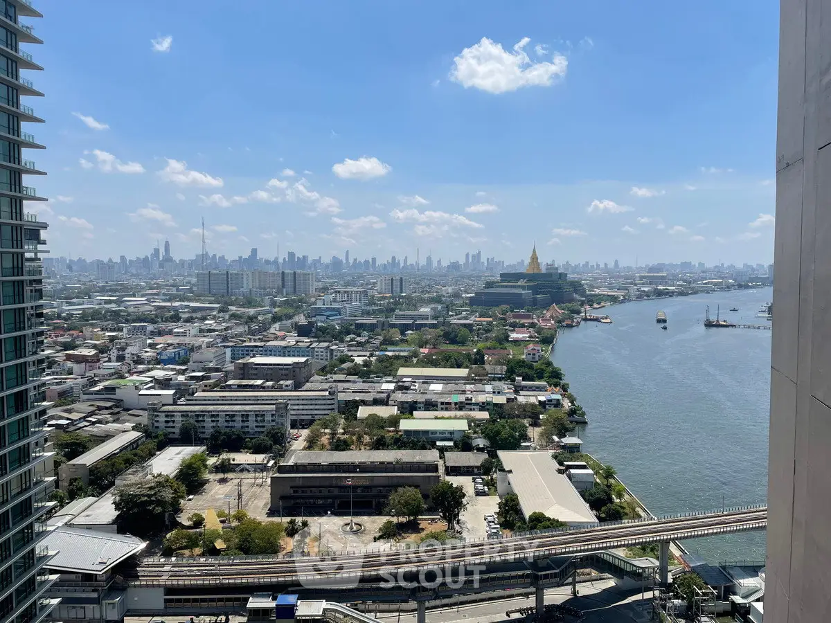 Stunning cityscape view with river and skyline from high-rise building, perfect for urban living enthusiasts.