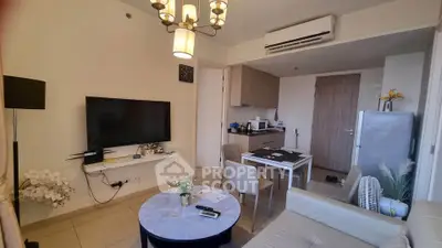 Modern living room with open kitchen, stylish decor, and air conditioning unit.