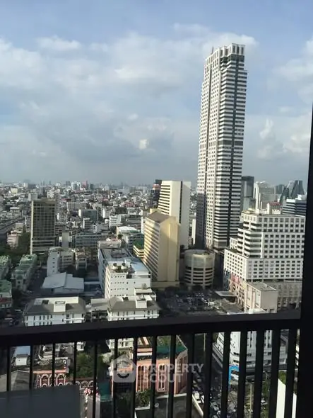 Stunning cityscape view from a high-rise balcony showcasing urban skyline and architectural marvels.