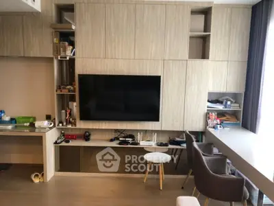 Modern living room with built-in entertainment center and stylish furniture
