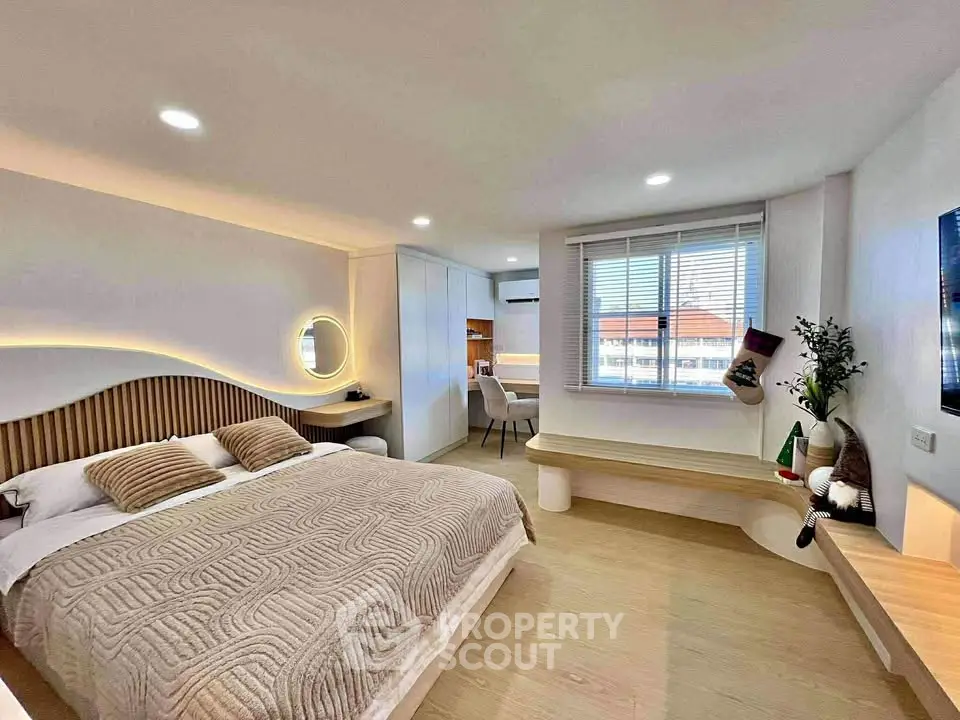 Luxurious modern bedroom with stylish decor and ambient lighting