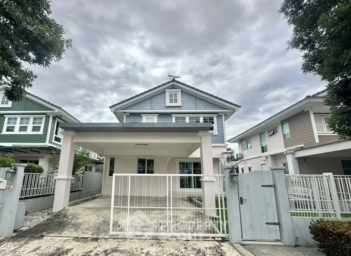 Charming two-story house with modern design and spacious driveway in a serene neighborhood.