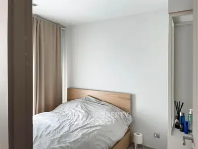 Cozy minimalist bedroom with natural light and neutral decor