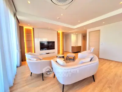 Spacious modern living room with elegant furniture and ambient lighting