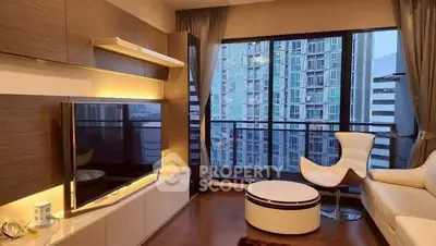 Modern living room with large windows and city view, featuring stylish furniture and ambient lighting.