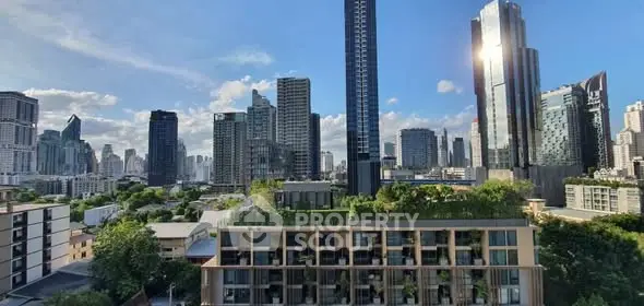 Stunning cityscape view with modern high-rise buildings and lush greenery.