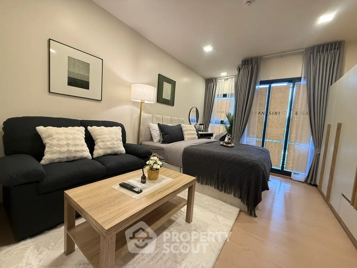 Modern studio apartment with cozy living area and stylish decor