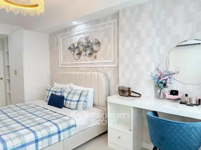 Chic bedroom with stylish decor, elegant bed, and modern vanity in a cozy apartment.