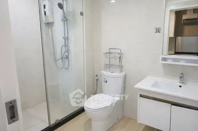 Modern bathroom with glass shower and sleek fixtures