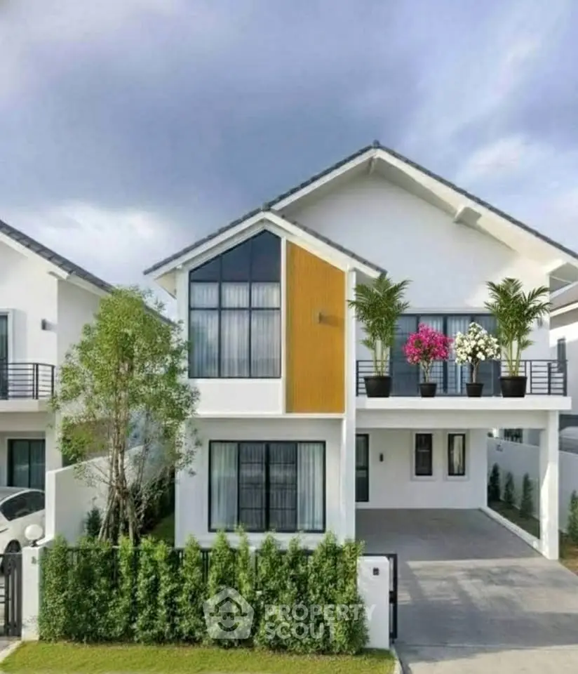 Modern two-story house with sleek design and landscaped front yard