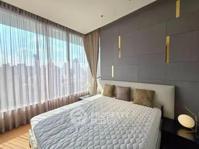 Luxurious bedroom with stunning city view and modern decor