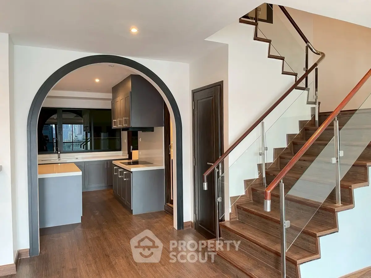 Elegant duplex with modern kitchen and stylish staircase