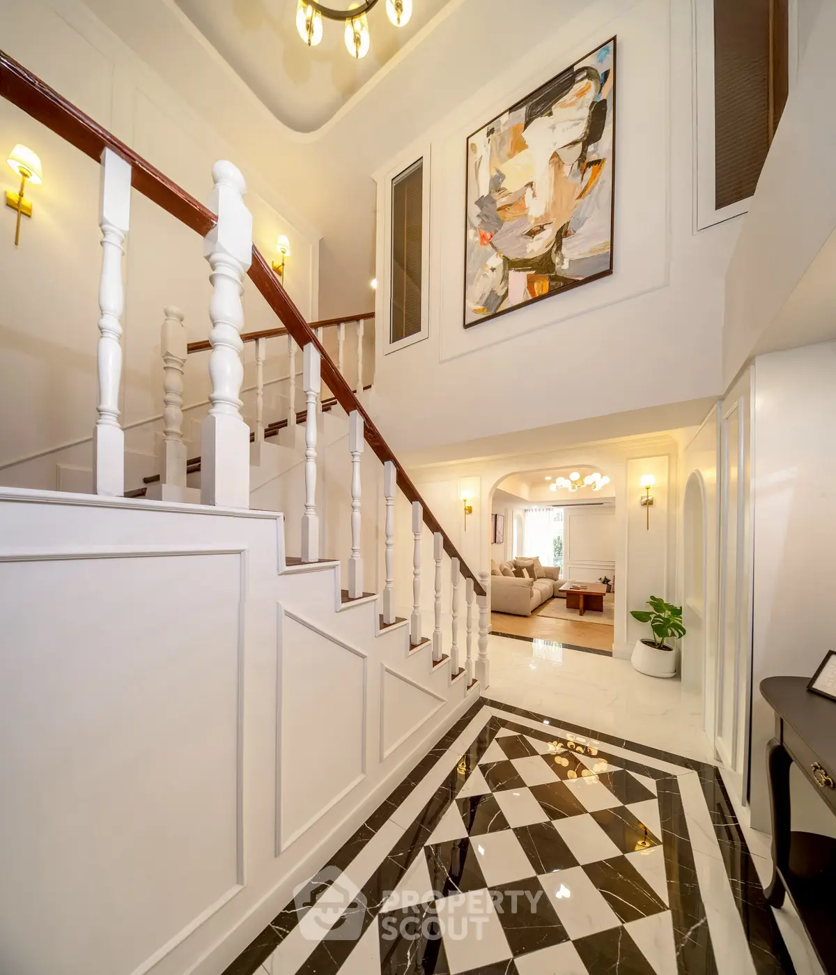Elegant entrance with stylish staircase and modern decor