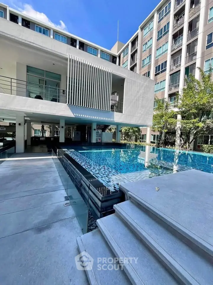 Luxurious modern apartment with stunning pool and sleek architecture