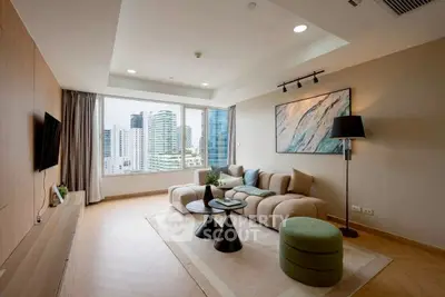 Modern living room with city view, stylish furniture, and elegant decor.