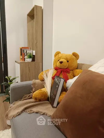 Cozy living room with plush teddy bear and modern decor