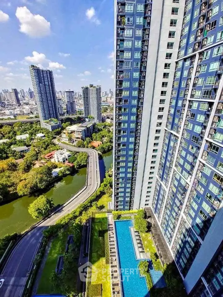 Stunning high-rise building with pool and city view, perfect for urban living.