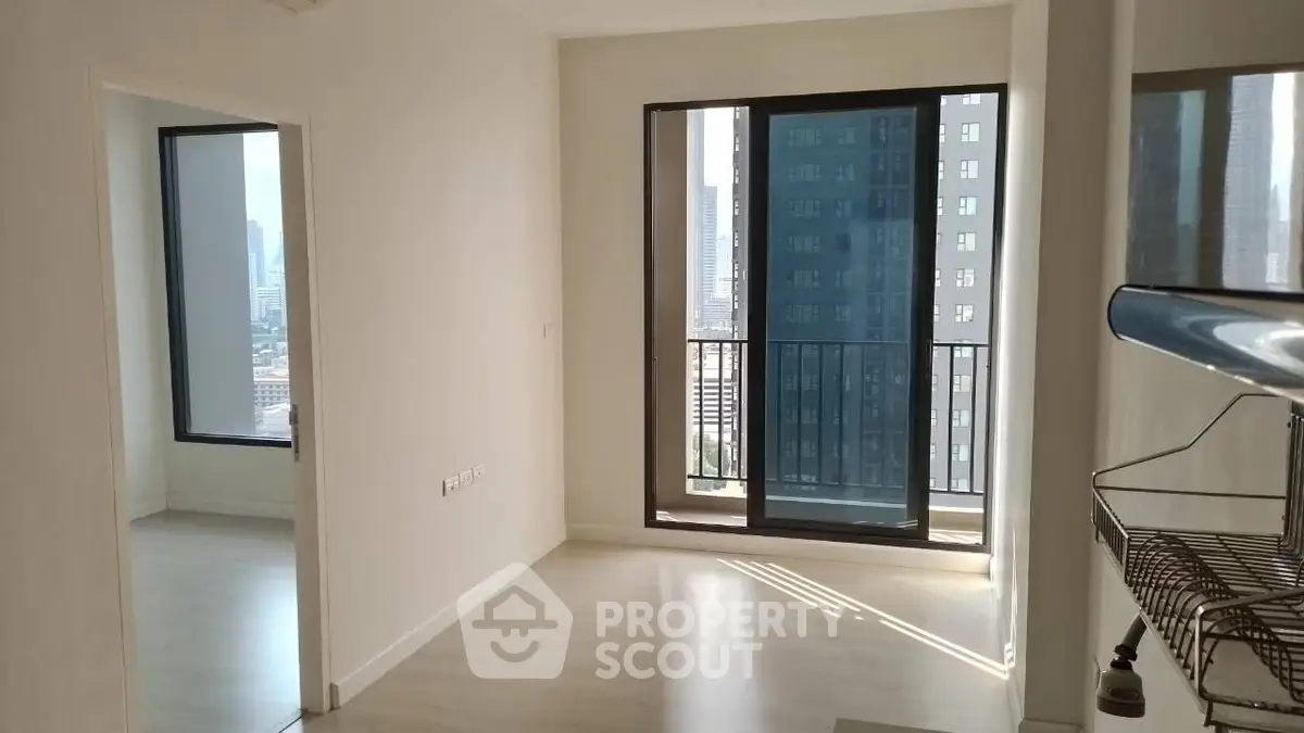 Bright modern apartment with city view and balcony access