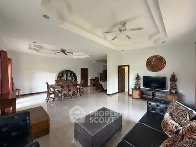 Spacious living room with elegant decor and modern furniture in a luxurious home.