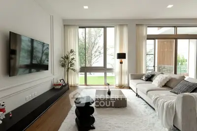 Luxurious modern living room with large windows and elegant decor