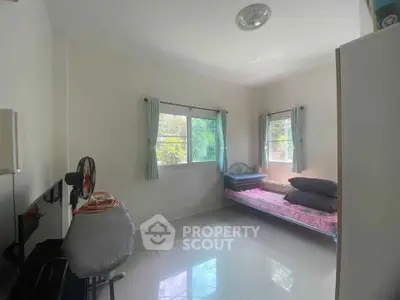 Cozy bedroom with natural light and minimalist decor