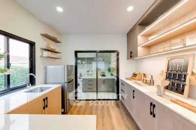 Modern kitchen with sleek design and open layout, featuring stainless steel appliances and ample natural light.