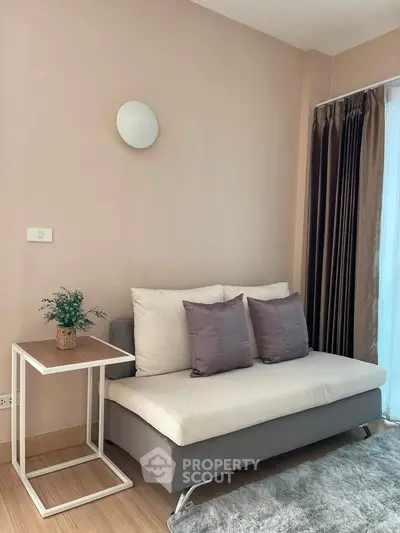 Cozy living room with modern sofa and elegant decor in a stylish apartment.
