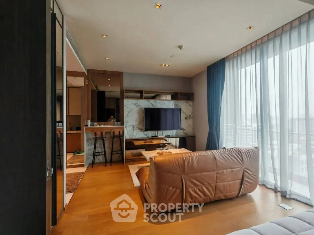 Luxurious modern living room with floor-to-ceiling windows and stylish decor